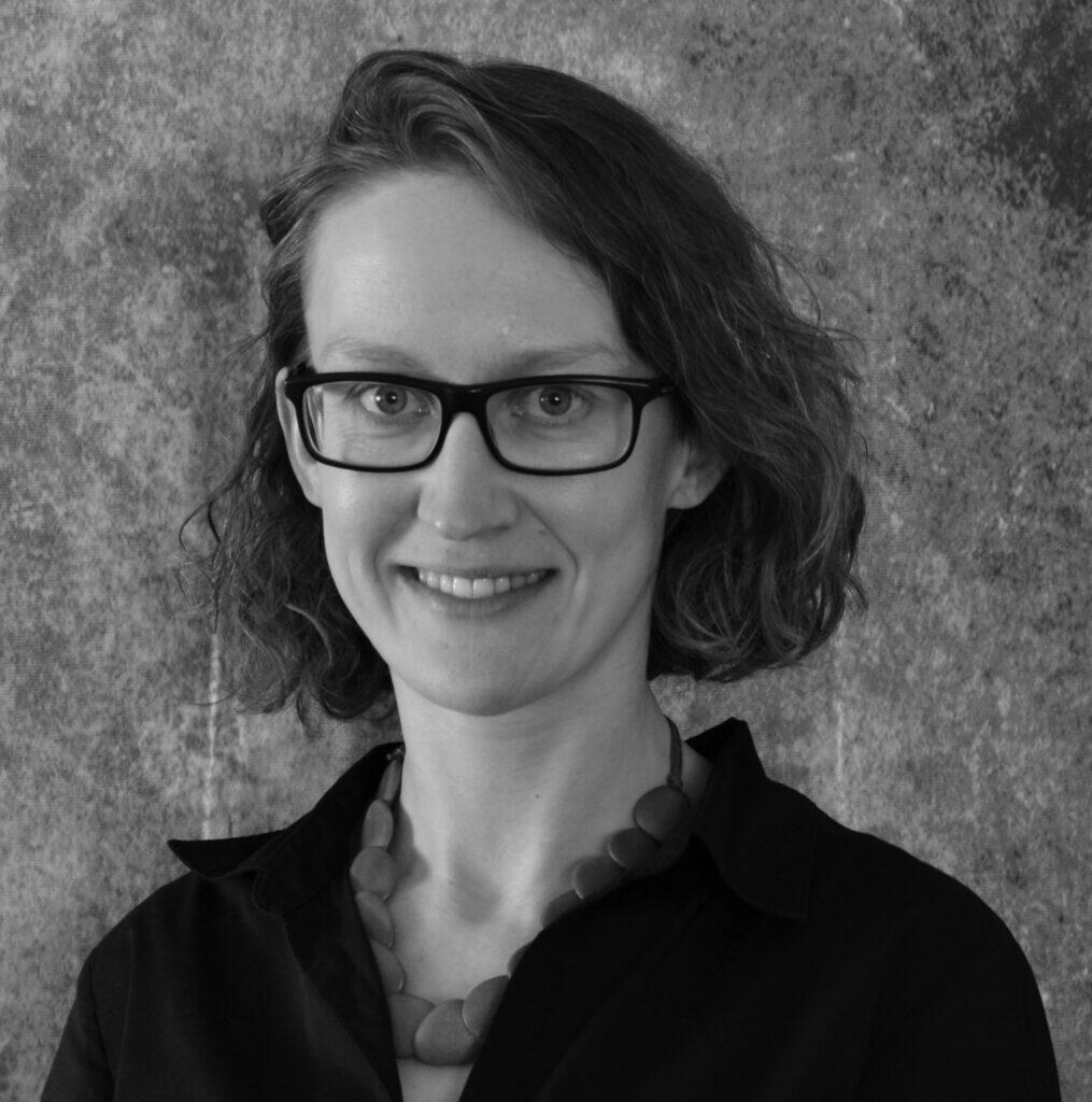 Black and white headshot of Katarina Slama.